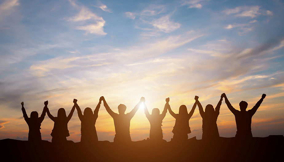 people with arms raised