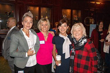 des in a group smiling