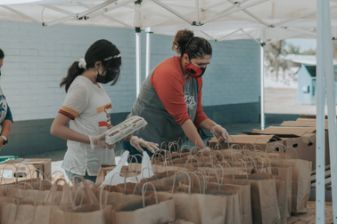 People volunteering at a food drive