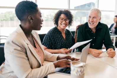 Couple working with credit union employee on financial plan