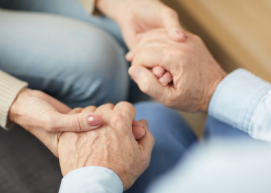 Two people holding hands