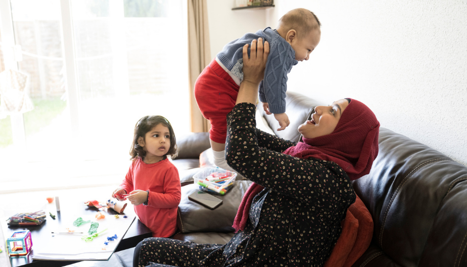A Muslim woman with two children