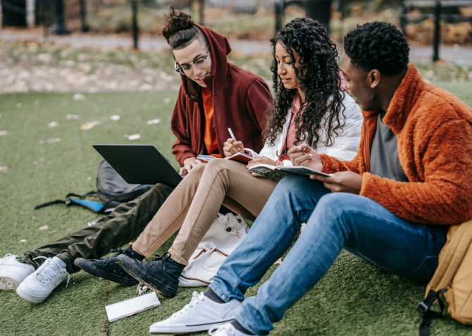 Group sitting together outside working