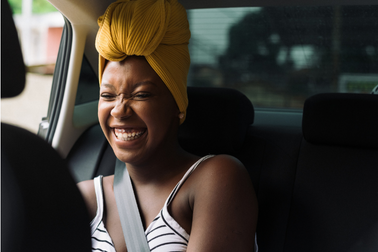 A young Black woman smiling