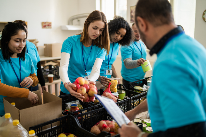 People volunteering at food pantry