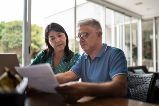 A couple looking at papers.