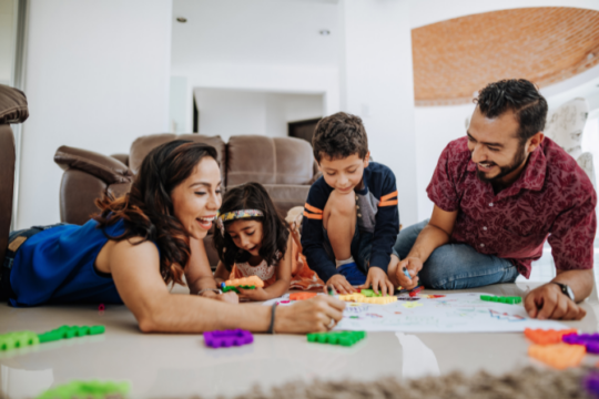 Young Latino family playing together