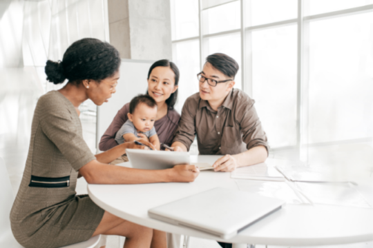 Young family meeting with credit union advisor