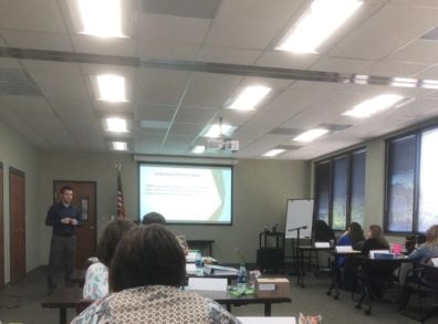 man presenting info at workshop