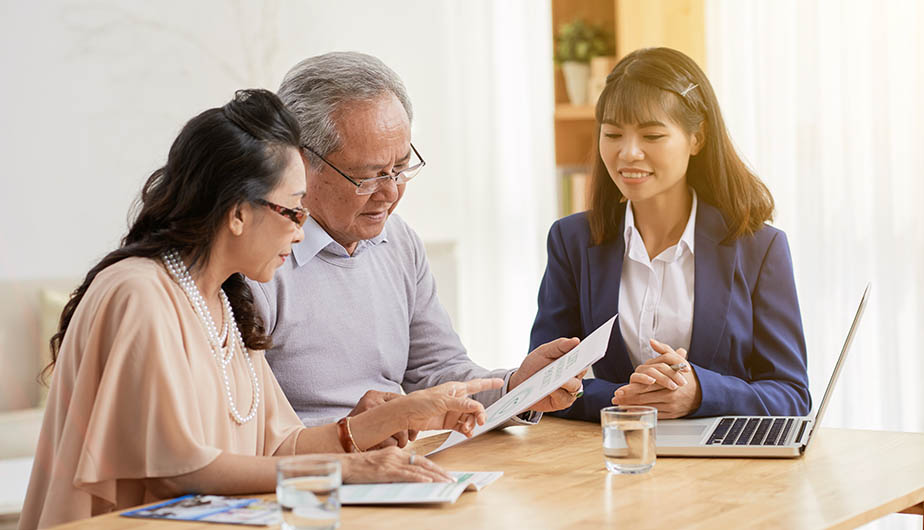 people looking at paper