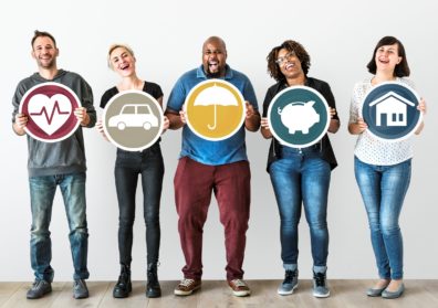 group of smiling people holding images